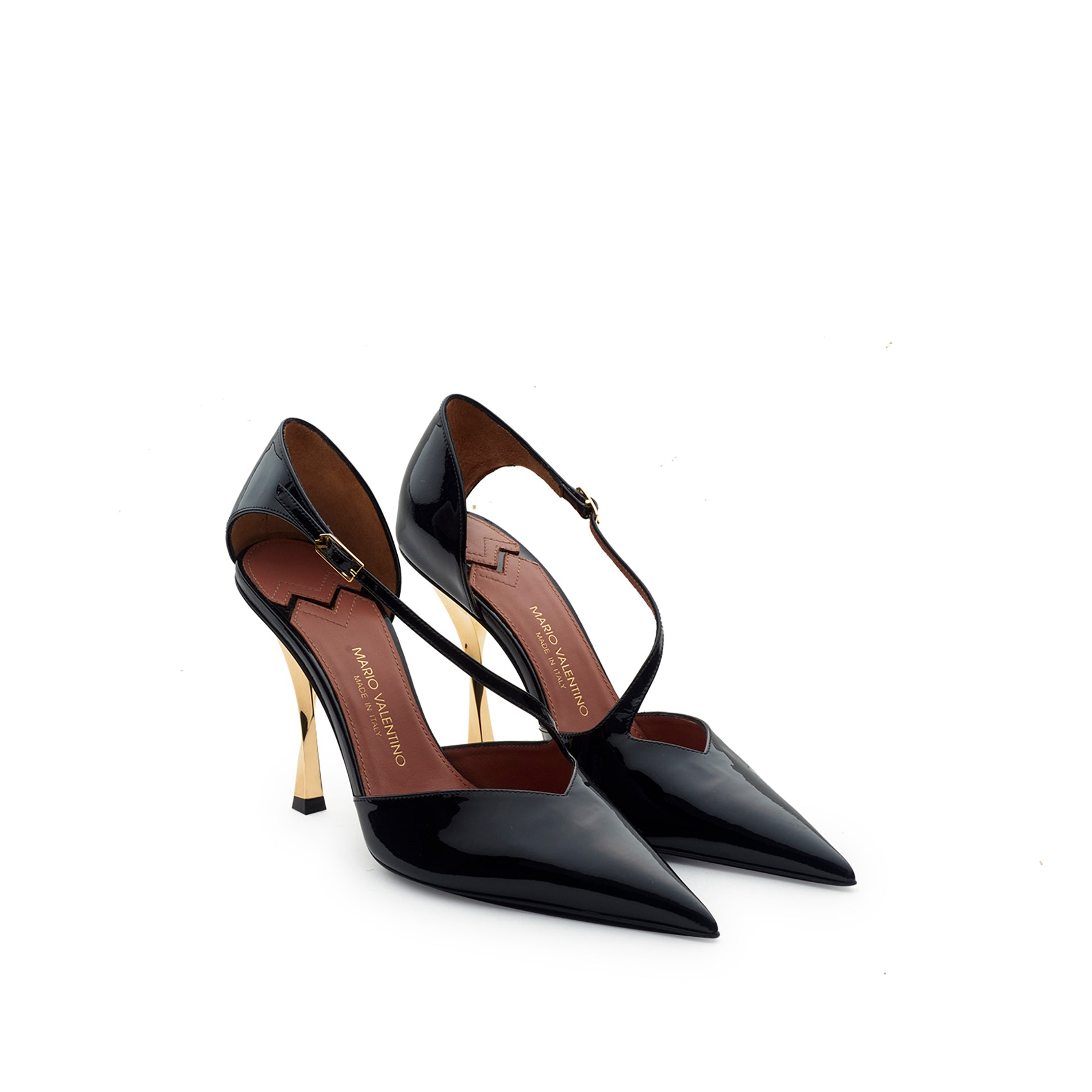 Pair of black patent leather slingback pumps with adjustable strap and sculptural gold heel Made in Italy
