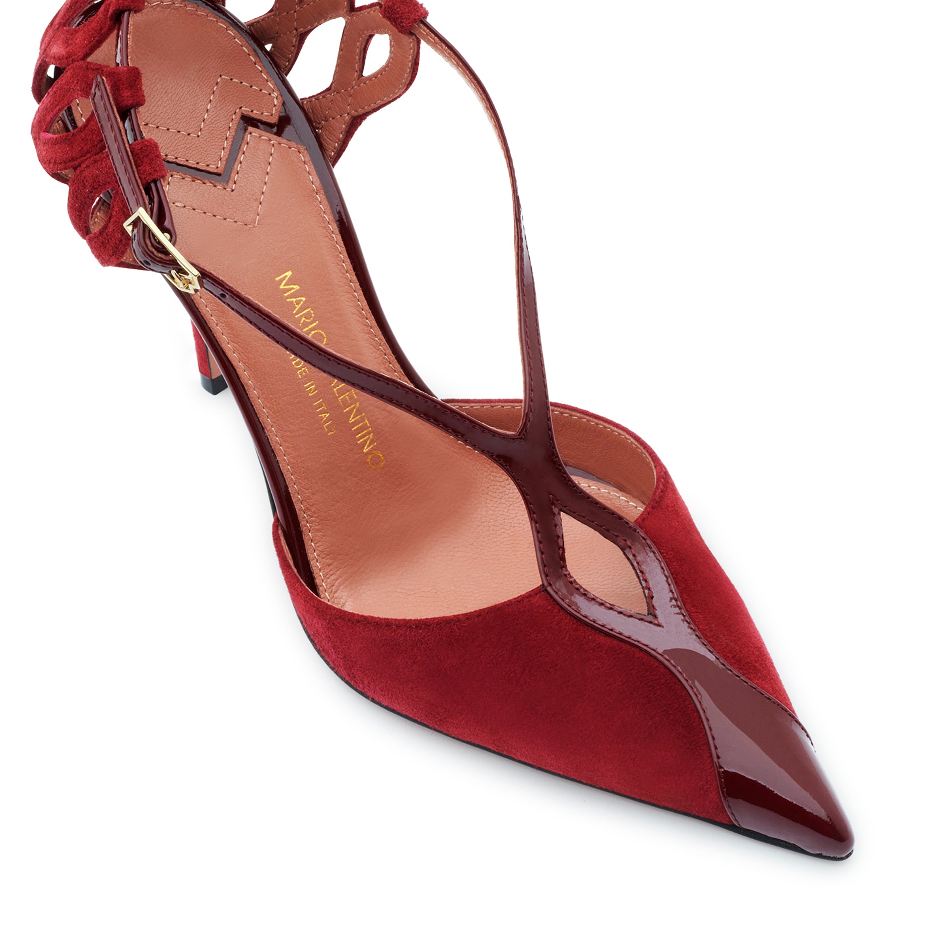 Detail of pointed toe burgundy pumps in smooth calfskin leather and suede with refined finish
