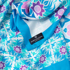 Detail of floral abstract print silk scarf by Mario Valentino, pure silk texture with soft and fluid finish