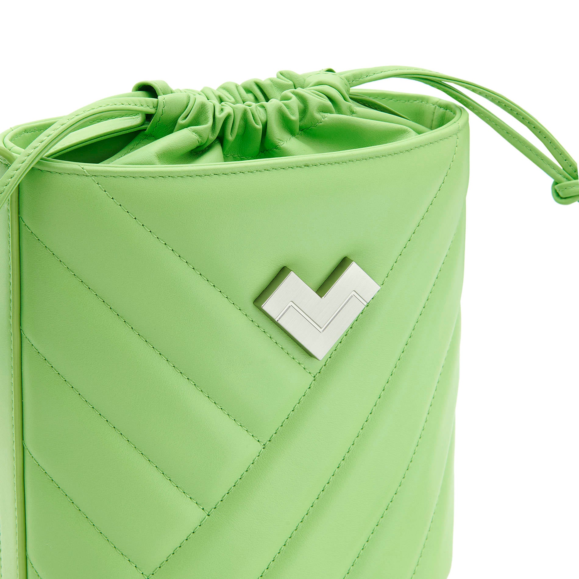 Green quilted leather crossbody bucket bag with chevron stitching, silver-tone logo and leather drawstring detail.
