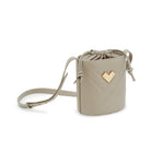 Grey quilted leather crossbody bucket bag with gold-tone logo, chevron stitching and leather drawstring detail.