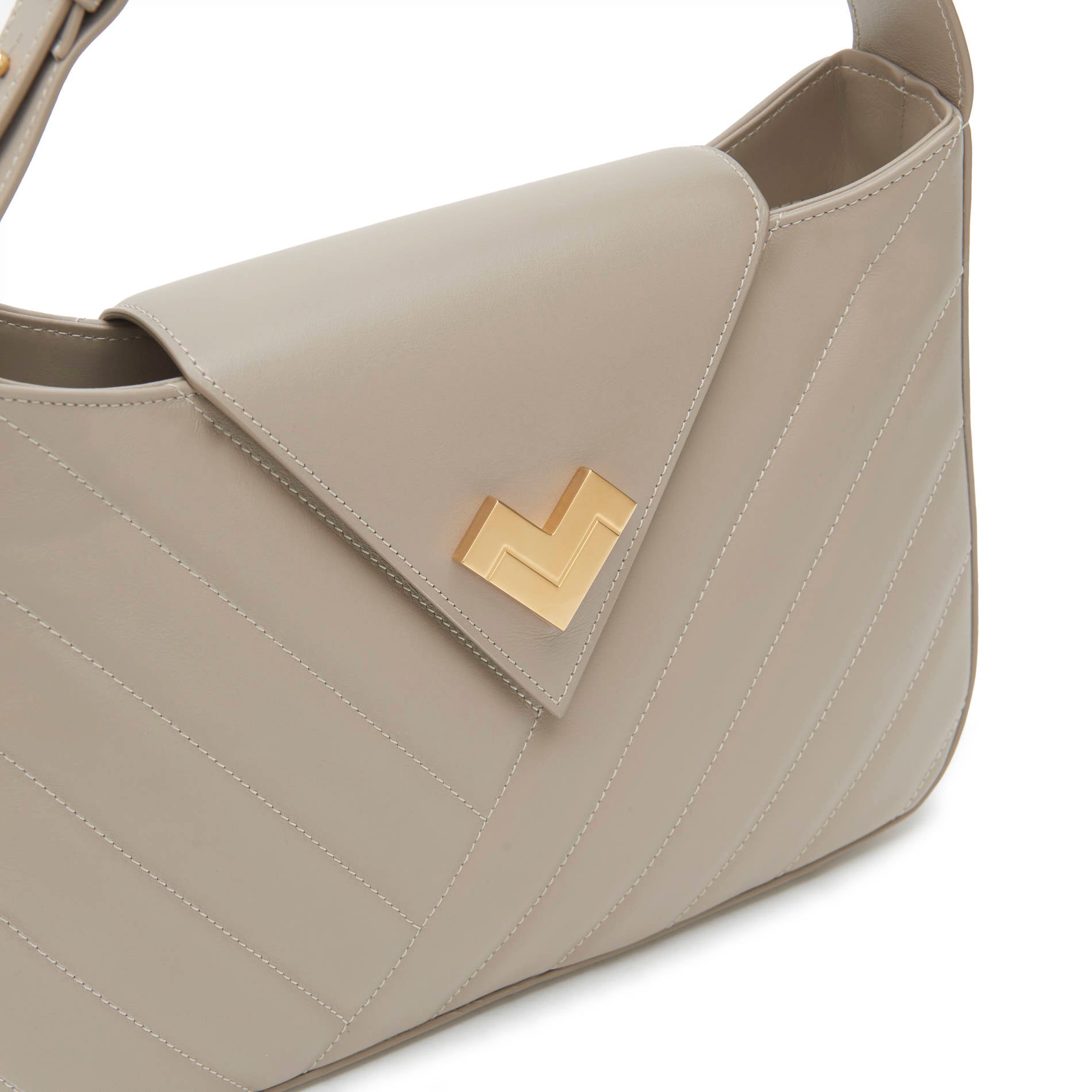Grey quilted leather shoulder bag in a taupe shade with gold logo and chevron detail. Made in Italy