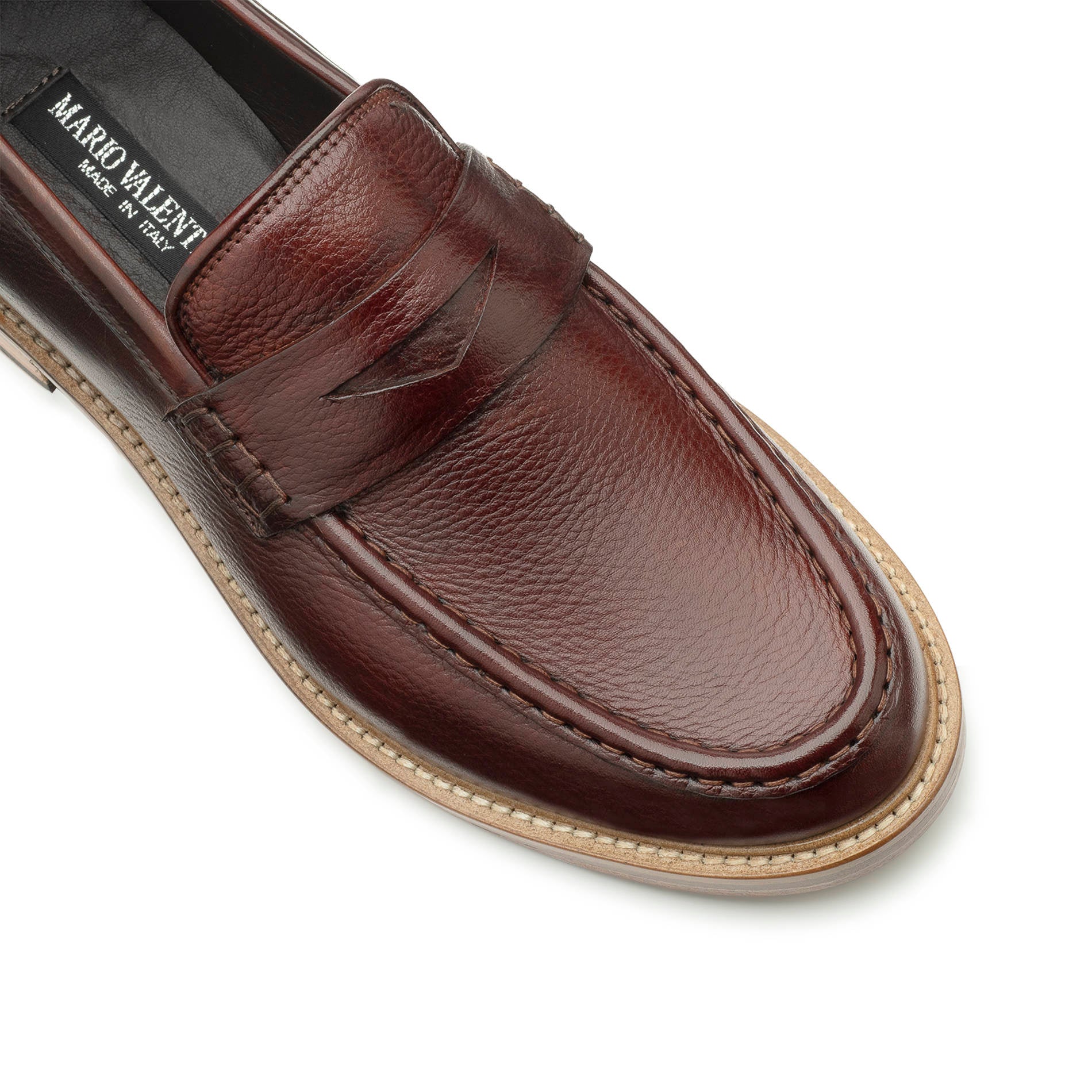 close-up leather texture brown penny loafer Italian craftsmanship