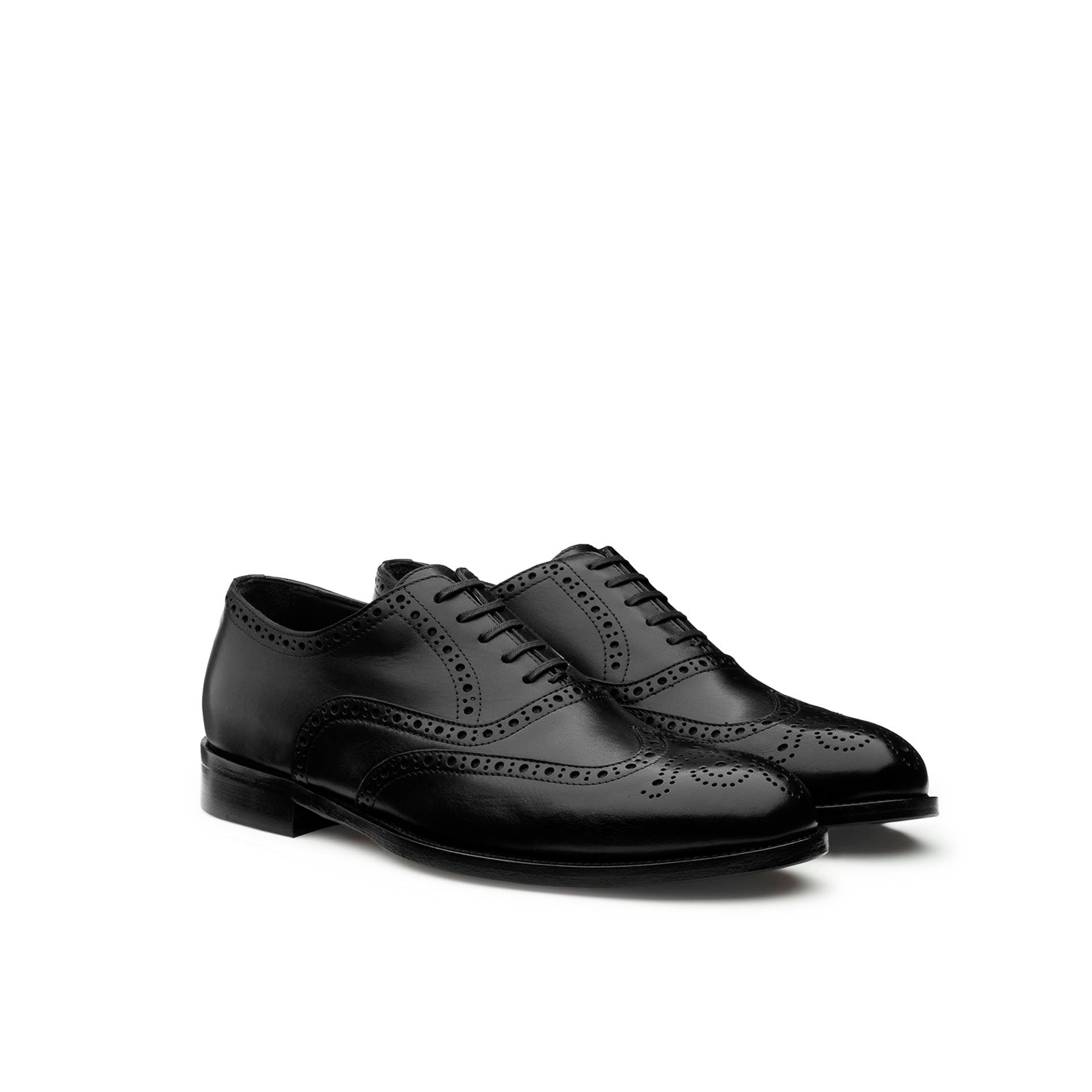 Pair of black calfskin brogue Oxford shoes by Mario Valentino, angled side view highlighting wingtip design
