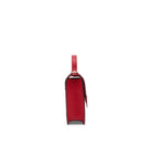 Side profile of the Mario Valentino red leather mini bag showing the structured gusset construction and gold-tone strap attachments.