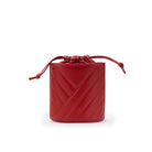 Red quilted leather crossbody bucket bag with gold logo and leather drawstring closure. Adjustable crossbody strap. Back view