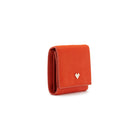 Mario Valentino red calf hair leather wallet side view, slim compact profile with flap closure and soft textured surface.