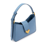 Detail of Mario Valentino light blue leather shoulder bag featuring gold MV logo closure and smooth calf leather finish. Made in Italy