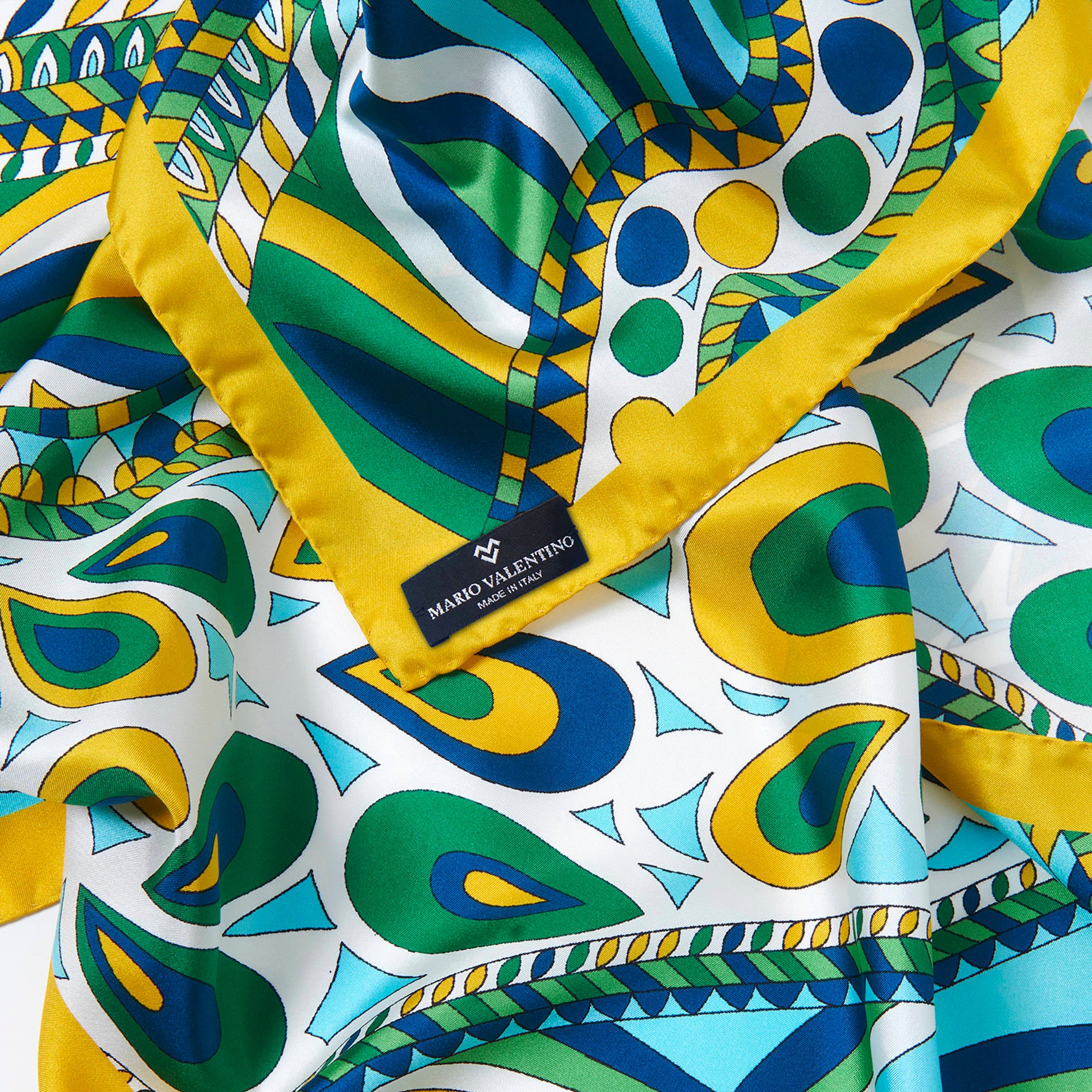 Luxury silk foulard by Mario Valentino with abstract motifs in vibrant tones, soft and fluid pure silk square scarf