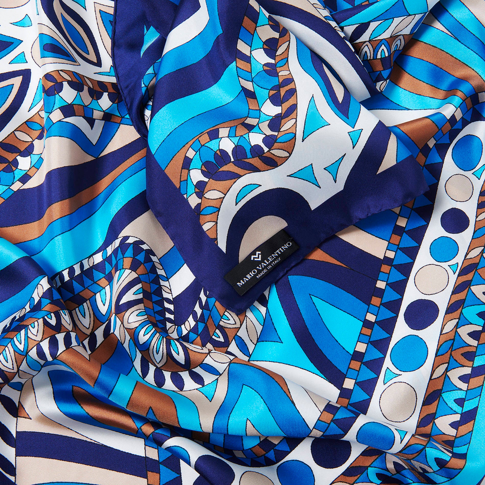 Mario Valentino pure silk scarf in blue, turquoise and ivory with abstract sinuous pattern and logoed label. Made in Italy.