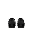 Back view Mario Valentino black leather loafers with structured heel