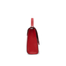Side view of Mario Valentino red calf leather top handle bag with structured silhouette