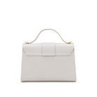 Rear view of the Mario Valentino white leather top-handle bag highlighting the clean finish and tonal stitching.