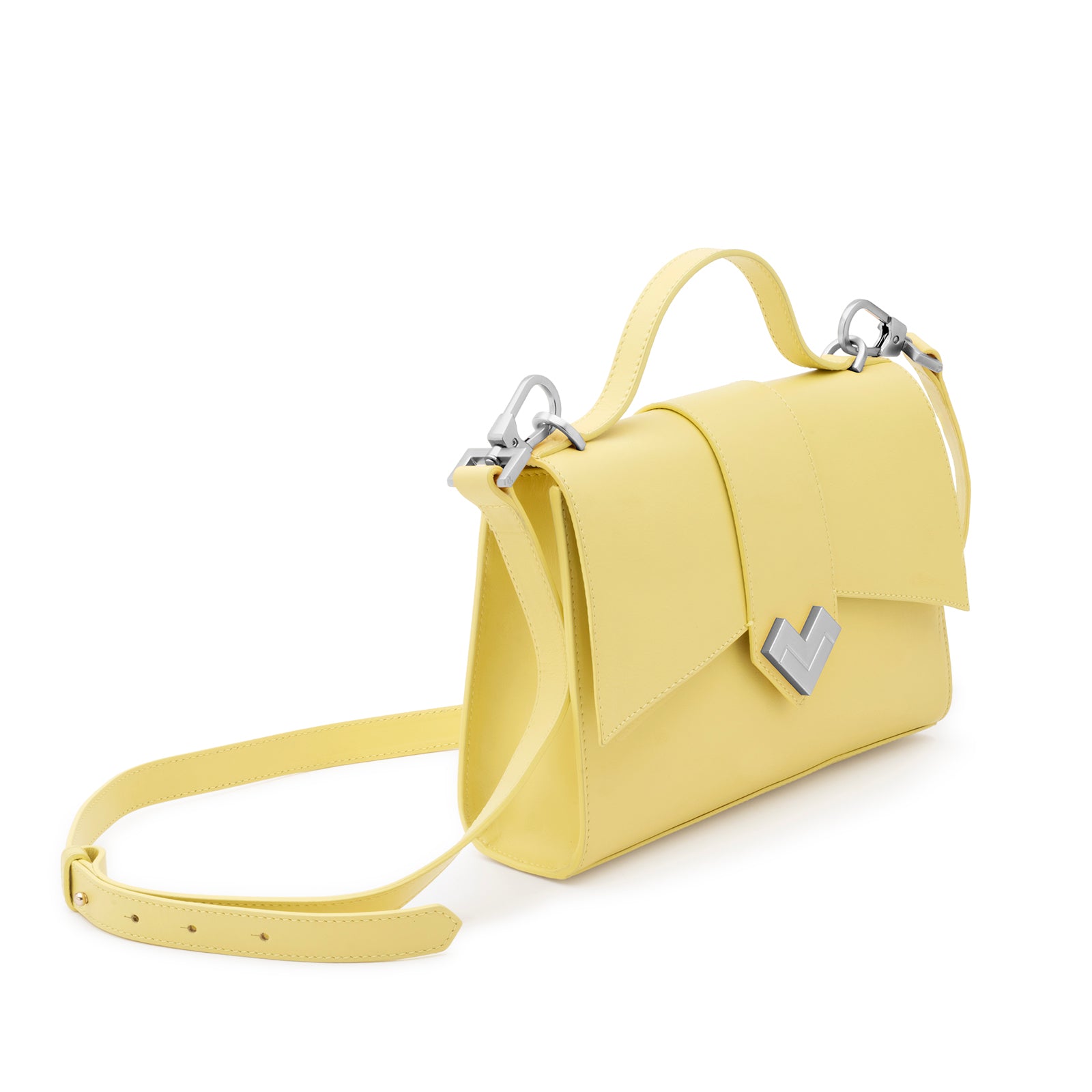 Angled view of the Mario Valentino yellow leather bag showing the structured silhouette and polished silver hardware
