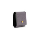 Mario Valentino grey calf hair leather wallet side view, slim compact profile with flap closure and soft textured surface.